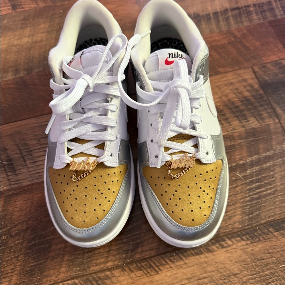 Nike Women’s White and Gold Sneakers